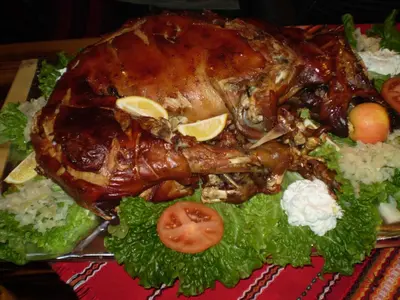 a chicken on a plate with rice and vegetables at Villa Filip in Bachevo