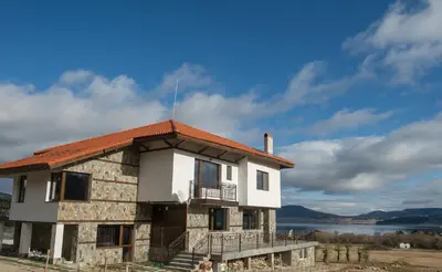 an old building with an orange roof on top of it at Vila Lidia in Tsigov Chark