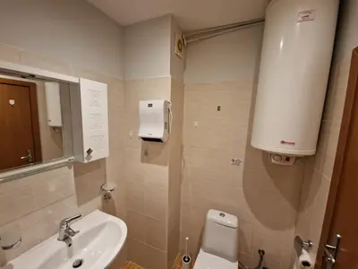a small bathroom with a sink and a toilet at Yastrebetz view in Borovets