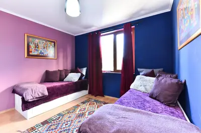 a room with two beds and a window at Gondola Flat Number 2 in Bansko