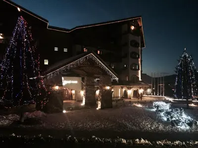 a group of christmas trees in front of a building at Gondola Flat Number 2 in Bansko