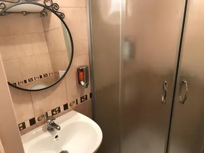 a bathroom with a sink and a shower at Pirin Heights in Bansko