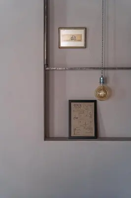 a mirror on a wall with a picture and lights at Design Hotel 36 in Sofia
