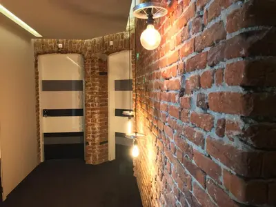 a brick wall with a light hanging from it at Design Hotel 36 in Sofia