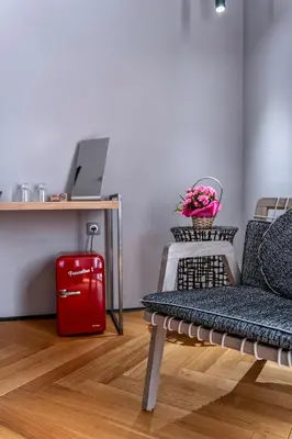 a room with a red suitcase and a red briefcase at Design Hotel 36 in Sofia