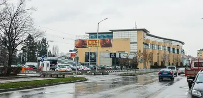 a busy city street with cars parked in front of buildings at Lozenets Executive Apartment with Private Parking in Sofia