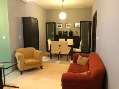 a living room with two chairs and a dining room at Han Krum 2 Bedroom Central Flat in Sofia