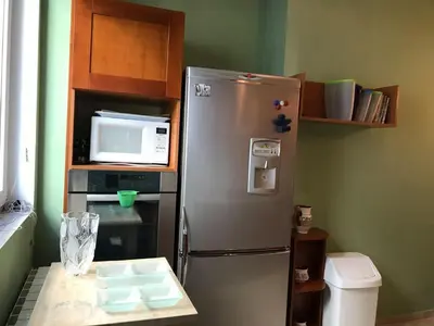 a kitchen with a stainless steel refrigerator and a microwave at Han Krum 2 Bedroom Central Flat in Sofia