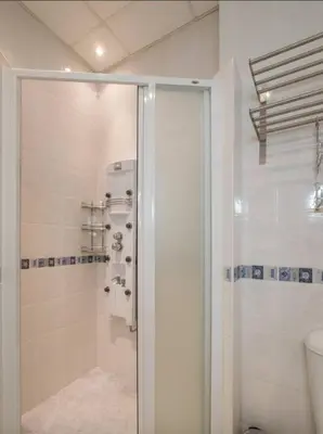 a bathroom with a shower with a glass door at Han Krum 2 Bedroom Central Flat in Sofia