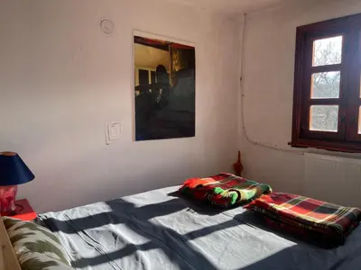 a bedroom with a bed with two pillows on it at Das Landhaus in Bachevo