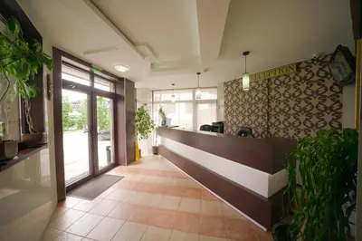 a lobby with a reception desk in a building at Apartments Flora-Daisy in Borovets