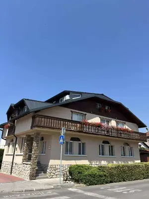 a large building on the side of a street at Hotel Four Seasons in Samokov