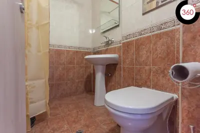 a bathroom with a toilet and a sink at Parchevich 31 Center Apartment - 24h Self Check-in in Sofia