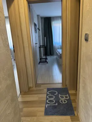 a door leading to a hallway with a welcome mat at Parchevich 31 Center Apartment - 24h Self Check-in in Sofia