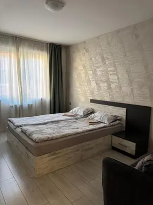 a bedroom with a bed and a large window at Parchevich 31 Center Apartment - 24h Self Check-in in Sofia