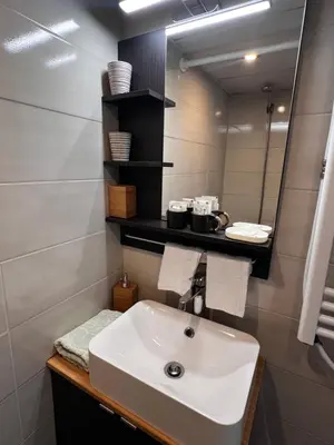 a bathroom with a sink and a mirror at The Yellow House in Sofia in Sofia