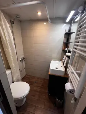a small bathroom with a toilet and a sink at The Yellow House in Sofia in Sofia
