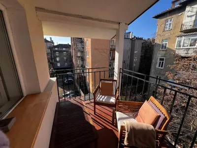 a balcony with two chairs on a balcony at The Yellow House in Sofia in Sofia