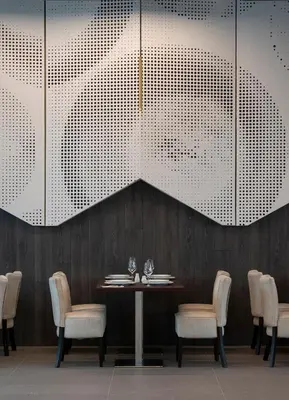 a dining room with a table and chairs at Euphoria Club Hotel in Borovets