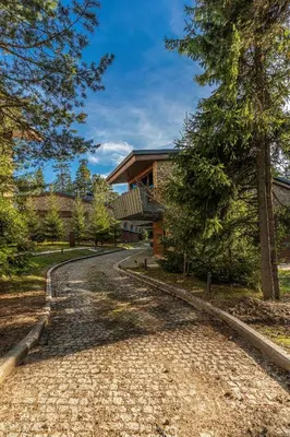 a cobblestone road in front of a house at Euphoria Club Hotel in Borovets