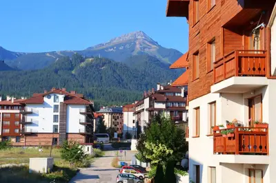 a view of a city with a mountain in the background at PIRIN PLACE Bansko in Bansko