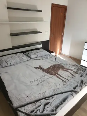 a bed with a picture of a deer on it at Luxury Two Bedroom Flat in Blagoevgrad