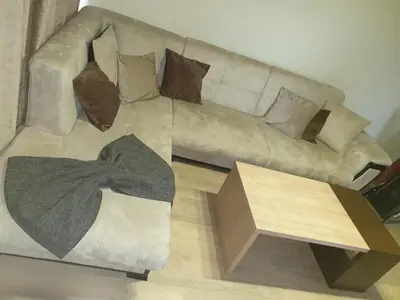a living room with a couch and a coffee table at Luxury Two Bedroom Flat in Blagoevgrad