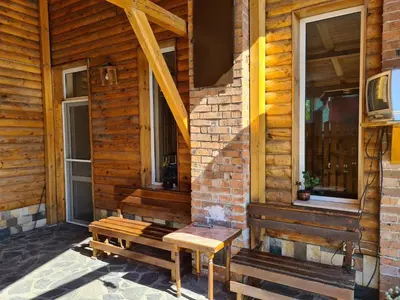 a bench sitting on the side of a building at Villa Mura in Razlog