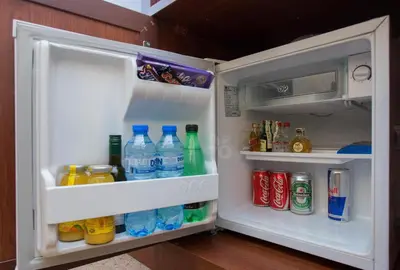 an open refrigerator filled with drinks and drinks at Favorit Hotel in Sofia
