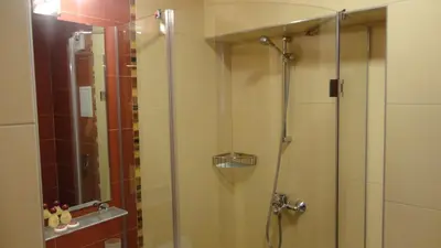 a bathroom with a shower with a glass door at Favorit Hotel in Sofia