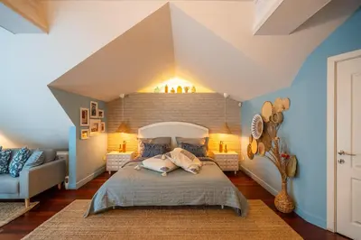a bedroom with a large bed and blue walls at RENOVATED Boutique Apartments Petrus in Sofia