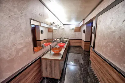a bathroom with a row of sinks with red bowls at Platinum Image Hotel in Elin Pelin