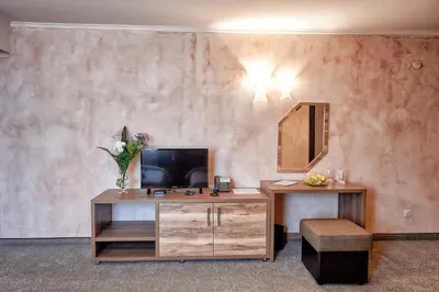 a room with a desk with a mirror and a chair at Platinum Image Hotel in Elin Pelin