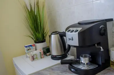 a coffee maker sitting on top of a counter at Oleander Rooms & Apartment in Sofia