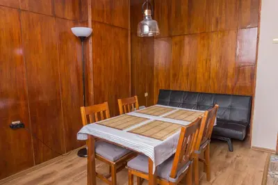 a dining room with a table and chairs at Oleander Rooms & Apartment in Sofia