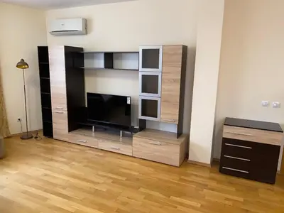 a large entertainment center with a television in a living room at Pravets Resort Apartments in Pravets