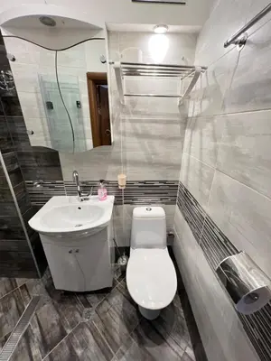 a bathroom with a toilet and a sink at Budapest Central Cozy Studio w Working Space and WiFi in Sofia