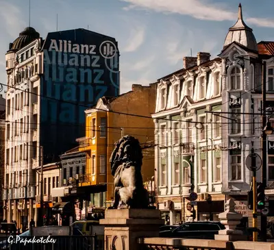 a statue in the middle of a city with buildings at Generaator Sofia in Sofia