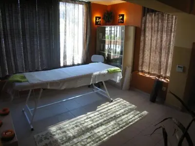 a room with a bed in a room with windows at Evridika Hotel in Devin