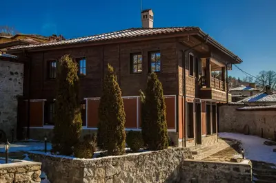 a house with trees in front of it at Red House in Koprivshtitsa