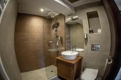 a bathroom with a sink and a toilet at Red House in Koprivshtitsa