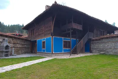 a building with blue paint on the side of it at ЧОЛАКОВАТА КЪЩА in Koprivshtitsa