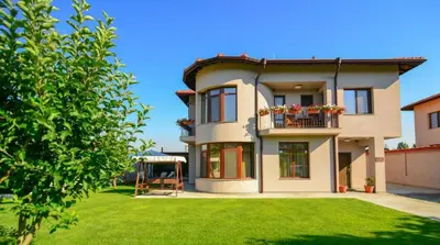 a large house with a lawn in front of it at KATERINA guest house in Kocherinovo