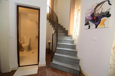 a staircase in a house with a stair case at KATERINA guest house in Kocherinovo