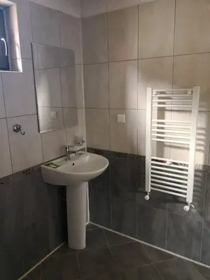 a bathroom with a sink and a mirror at Yurukovata kashta in Koprivshtitsa