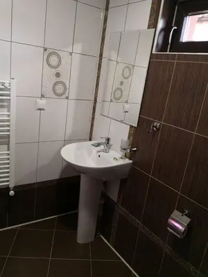a bathroom with a sink and a mirror at Yurukovata kashta in Koprivshtitsa