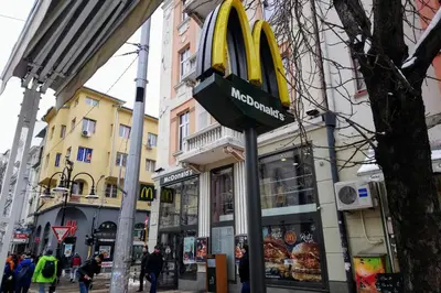 a mcdonalds sign on the side of a street at Interhost Guest rooms and apartments in Sofia