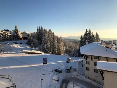 an aerial view of a building in the snow at VIP Apartment Stenata Complex in Pamporovo