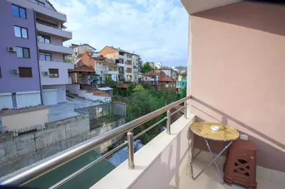 a balcony with a table and a view of a city at Studio Ivana in Sandanski