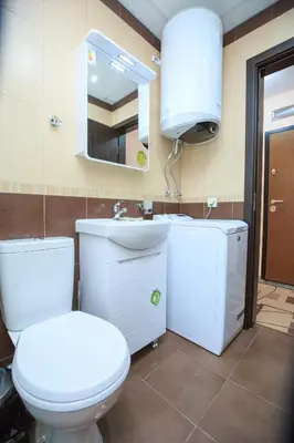 a bathroom with a toilet and a sink and a mirror at Studio Ivana in Sandanski